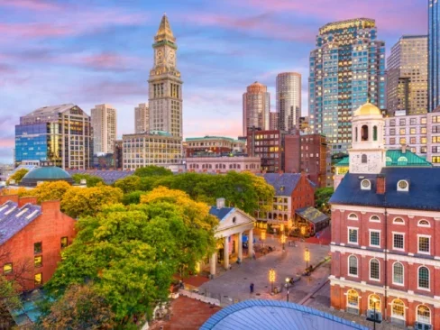 Boston, Massachusetts, USA skyline with Faneuil Hall and Quincy Market at sunset