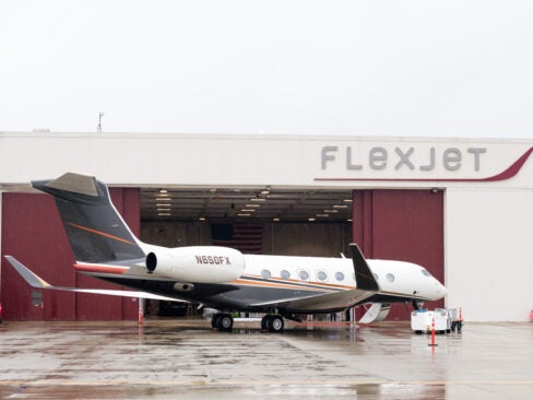 flexjet plane outside airport hangar