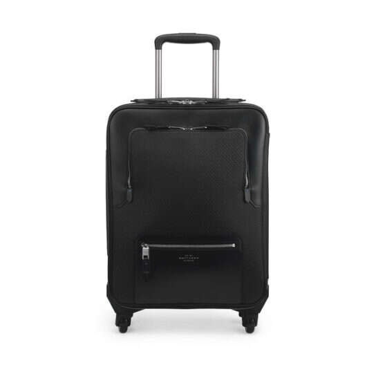 The Best Luxury Suitcases Worth Splurging On—Rimowa, Prada, Ghurka