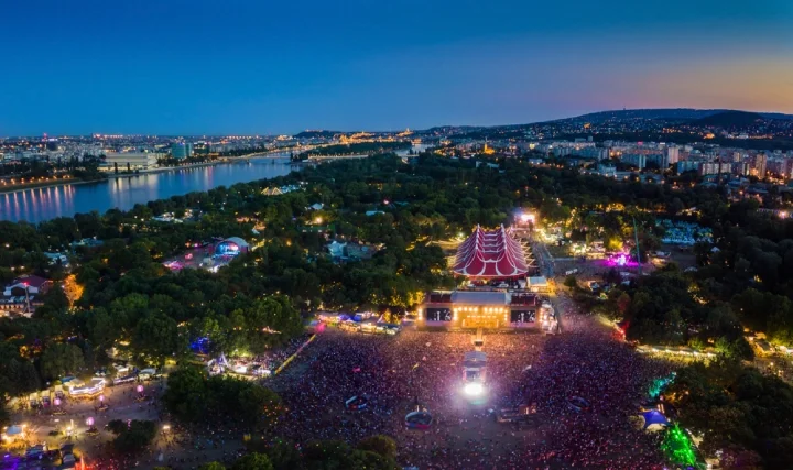 Aerial panoramic skyline view of Budapest at blue hour with main stage of Sziget festival