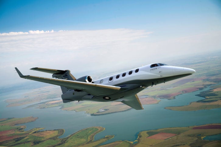 Embraer Phenom 300 in flight