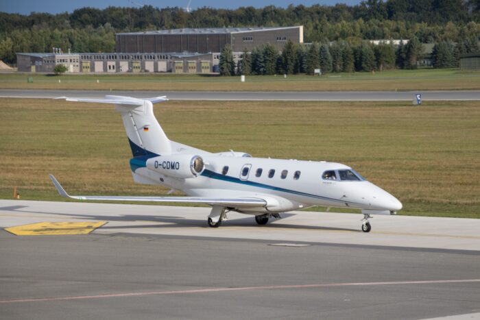 embraer phenom 100 private jet on runway
