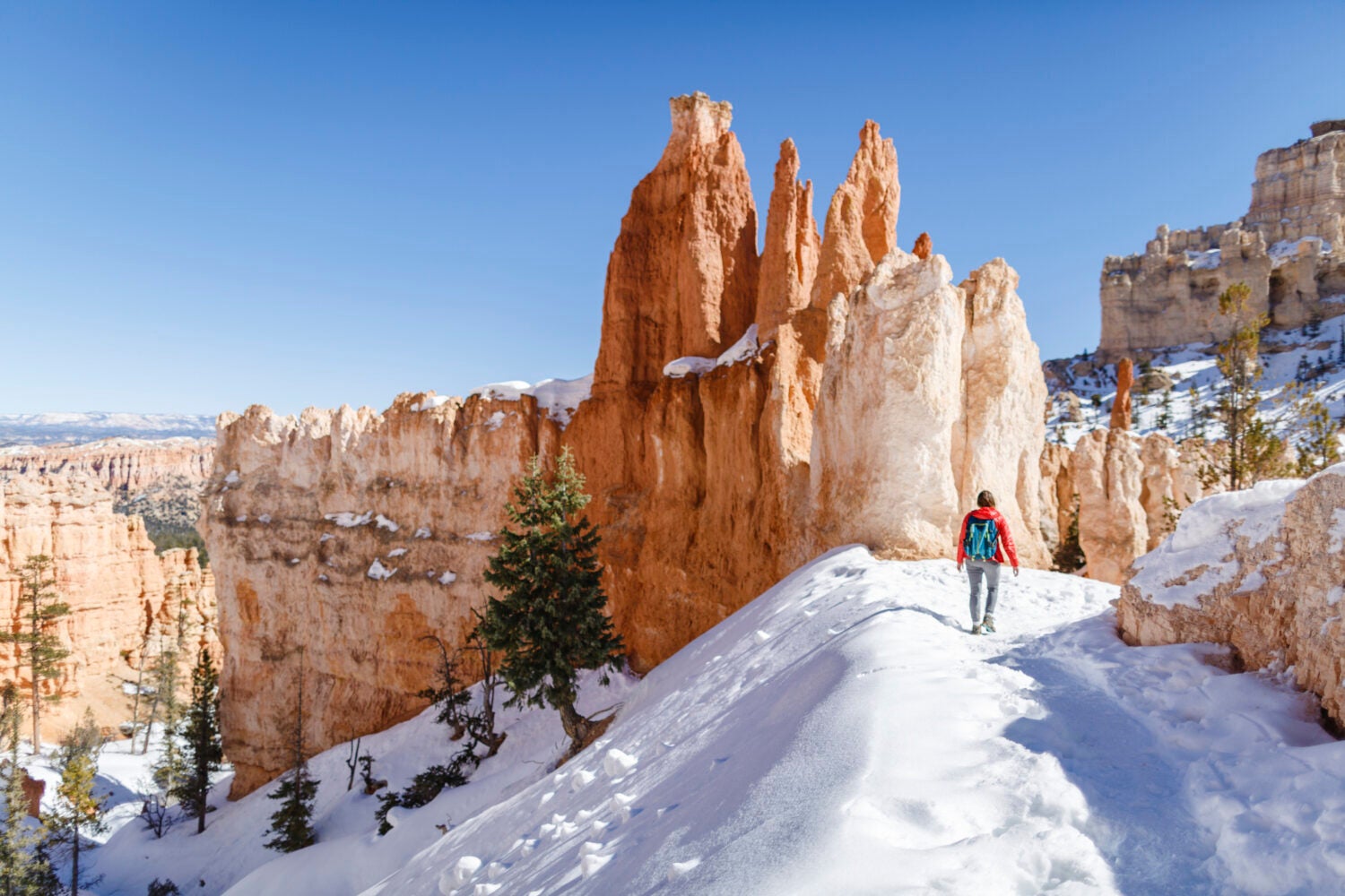 Lone hiker at Snow covered Bryce Canyon