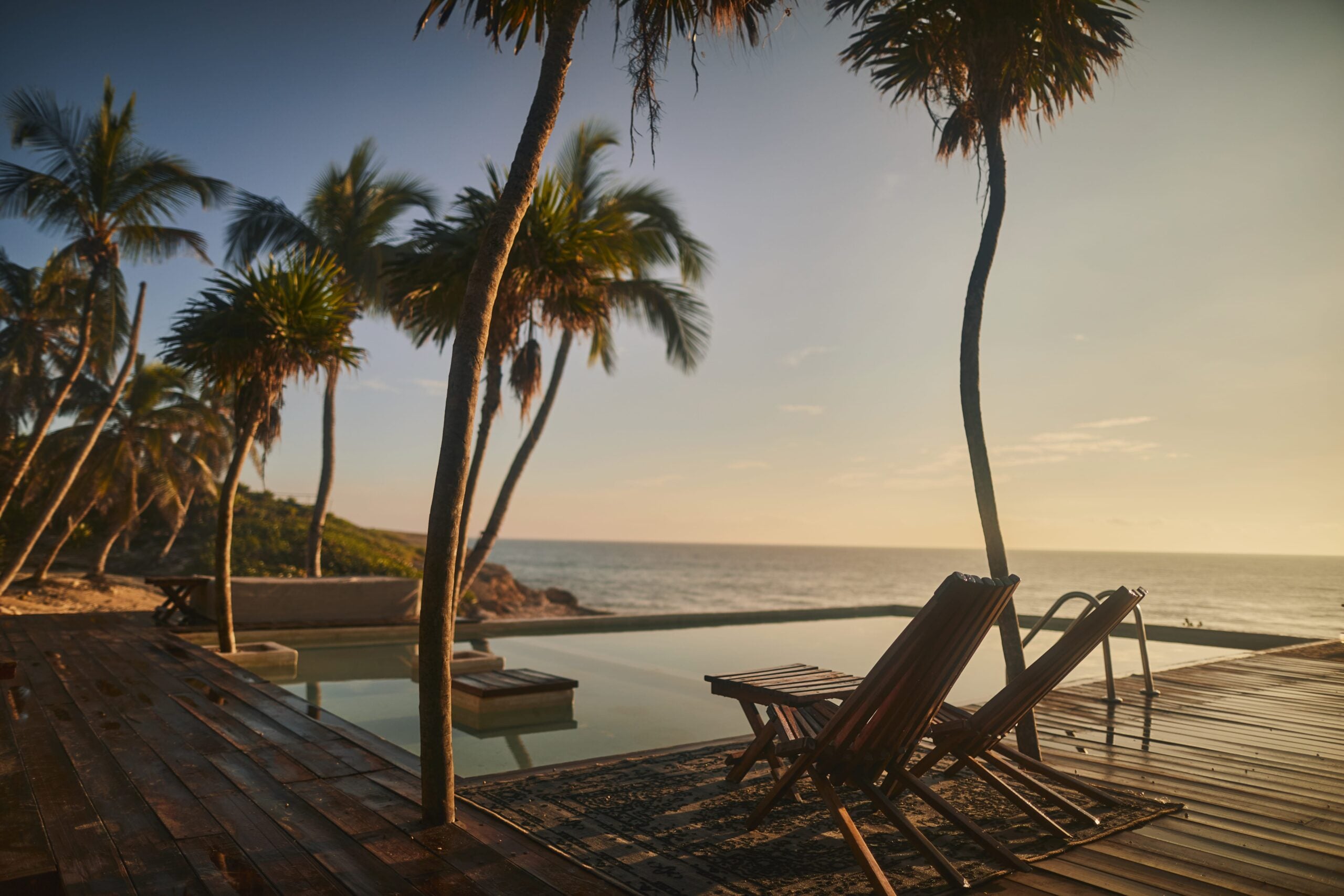 habitas tulum poolside view at sunset