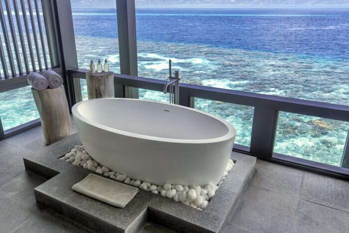 kudadoo private island bathtub overlooking ocean