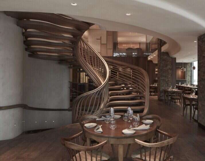 hide restaurant table and spiral staircase