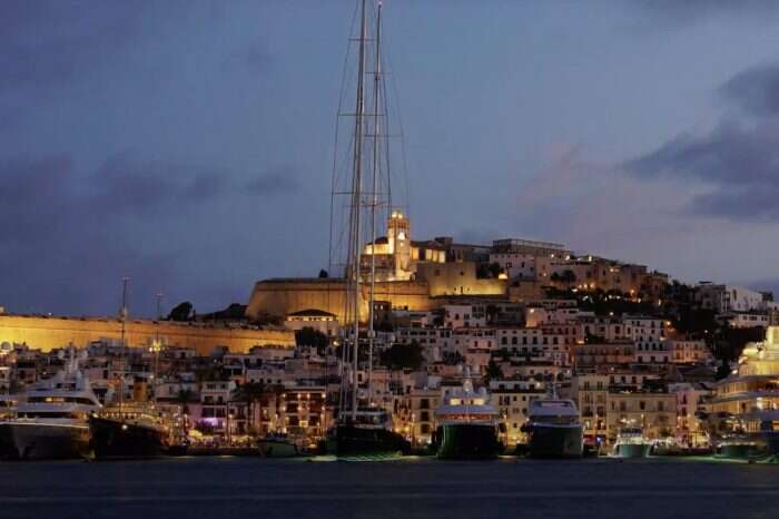 view of ibiza old town from boat at night