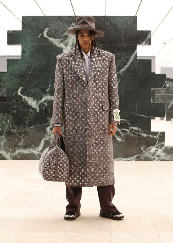 Man in LV coat with bag