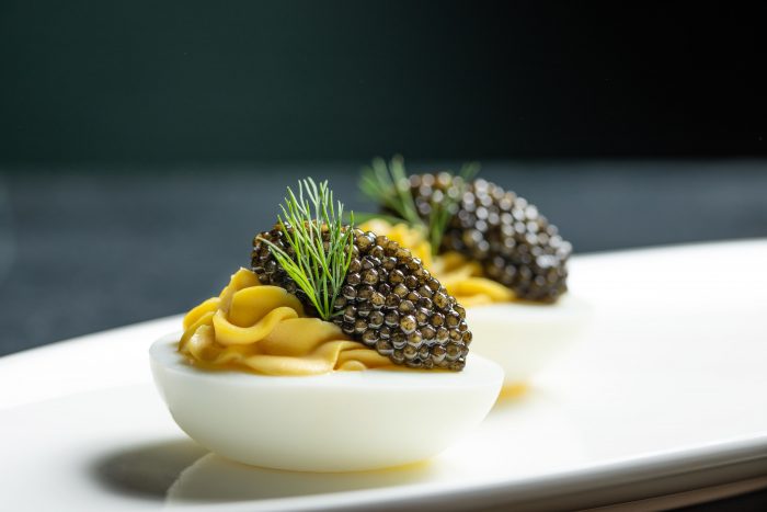 caviar served on deviled eggs at thomas keller pop up champagne and caviar lounge