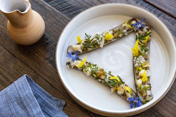 locally sourced razor clam dish at the osprey restaurant