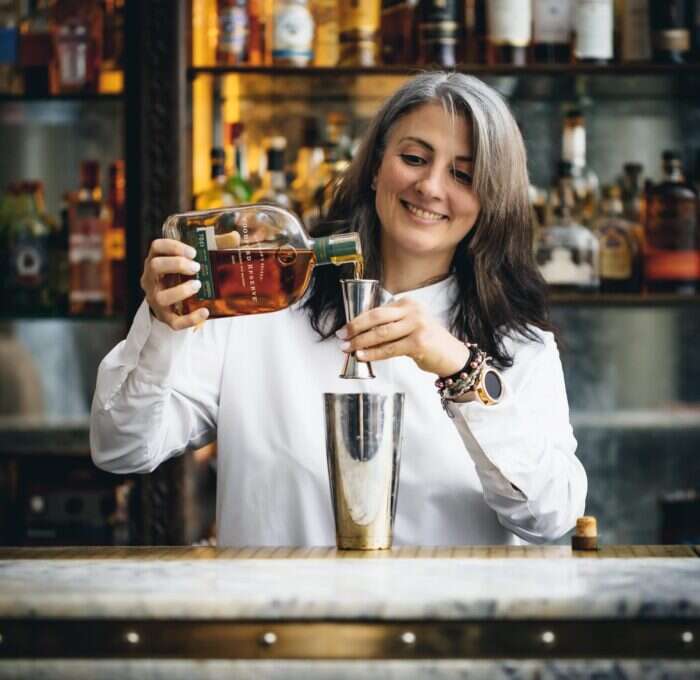 artesian head bartender making cocktail