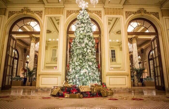 Christmas tree and presents in the lobby at The Plaza hotel New York