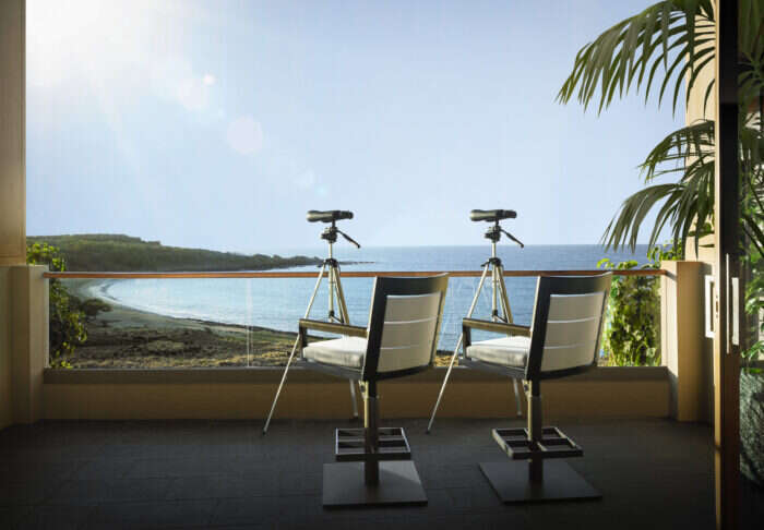 The balcony with binocular tripods at the Alii Royal Suite at Four Seasons Resort Lanai