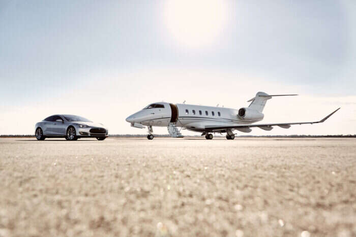 sentient jet and car on tarmac