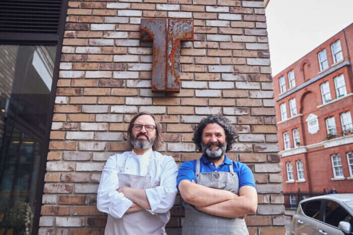 Jonny Lake and Isa Bell stand outside Trivet restaurant 