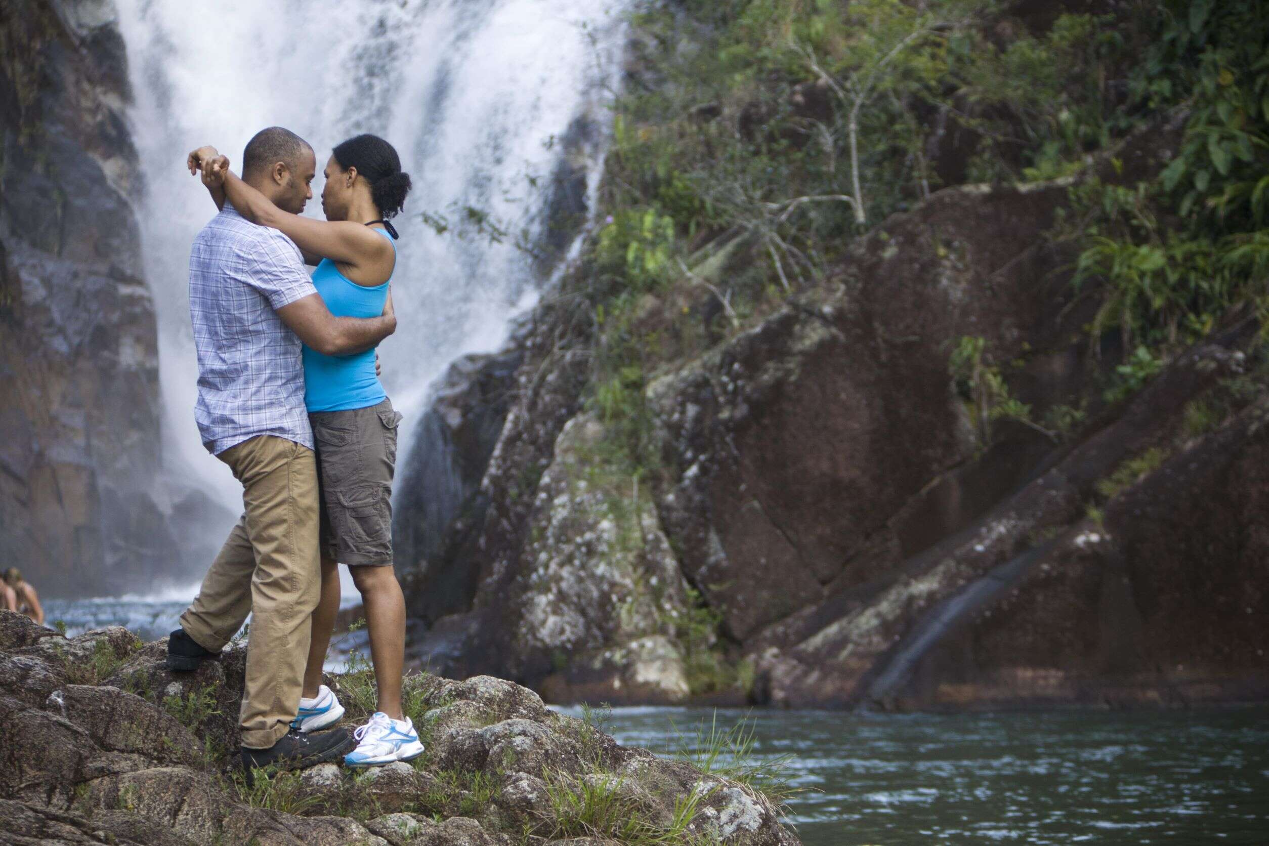 Romantic couple near waterfall