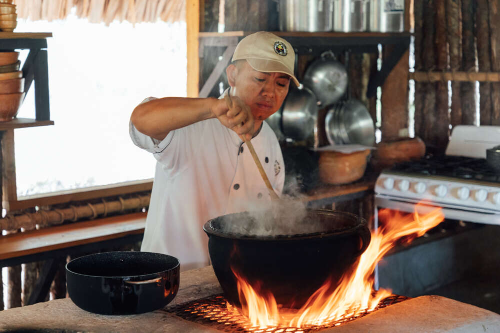 Often restaurants will have open kitchens where chefs cook in full view of diners / Courtesy of Travel Belize