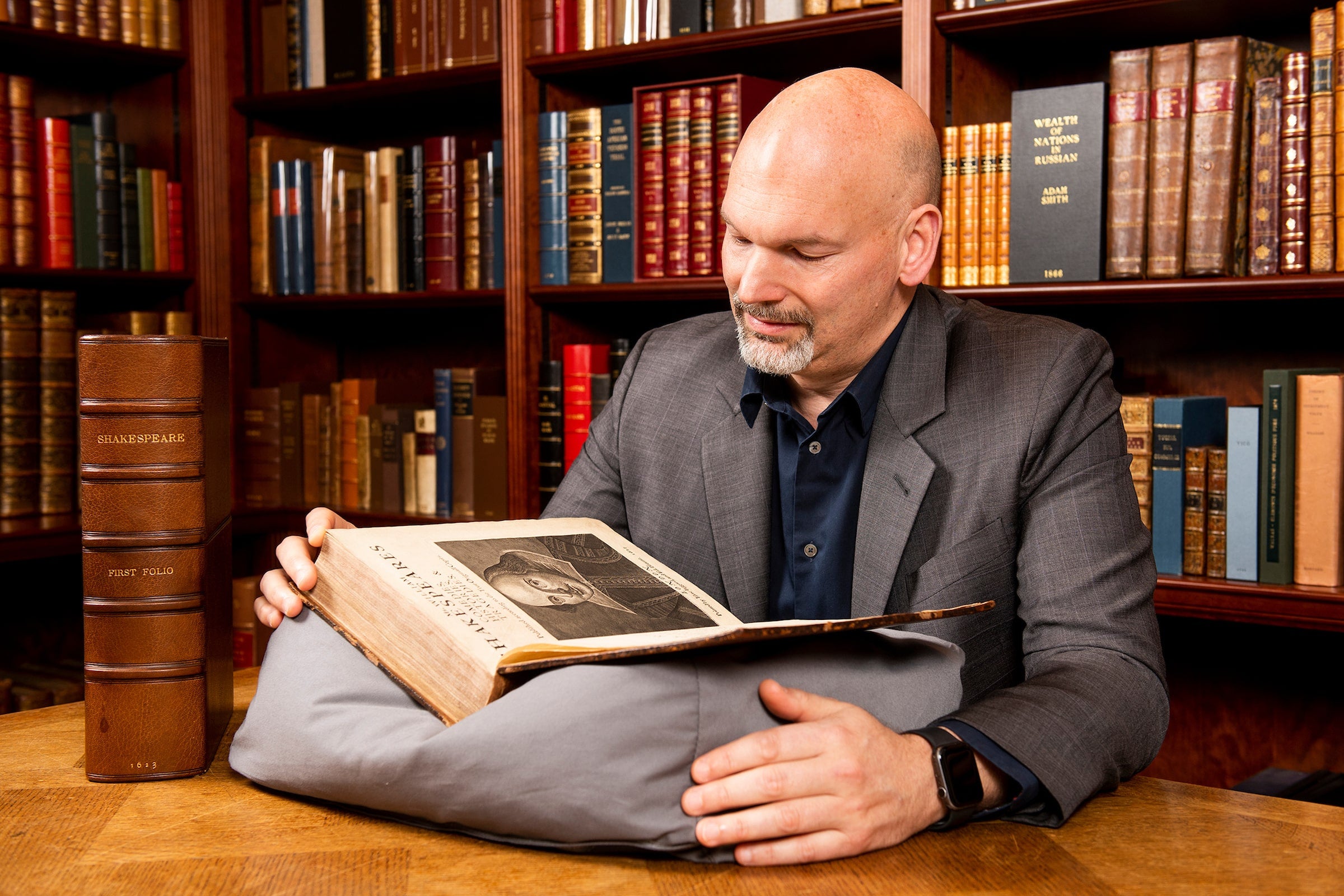 Pom Harrington with Shakespeare's First Folio