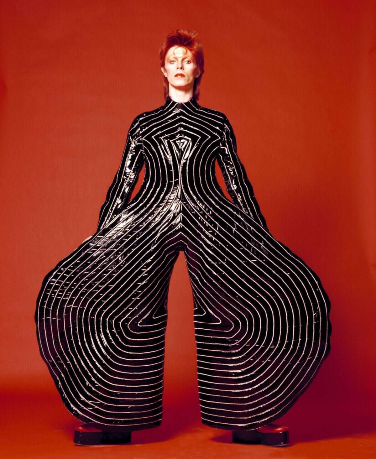 david bowie in striped bodysuit for Aladdin Sane tour 