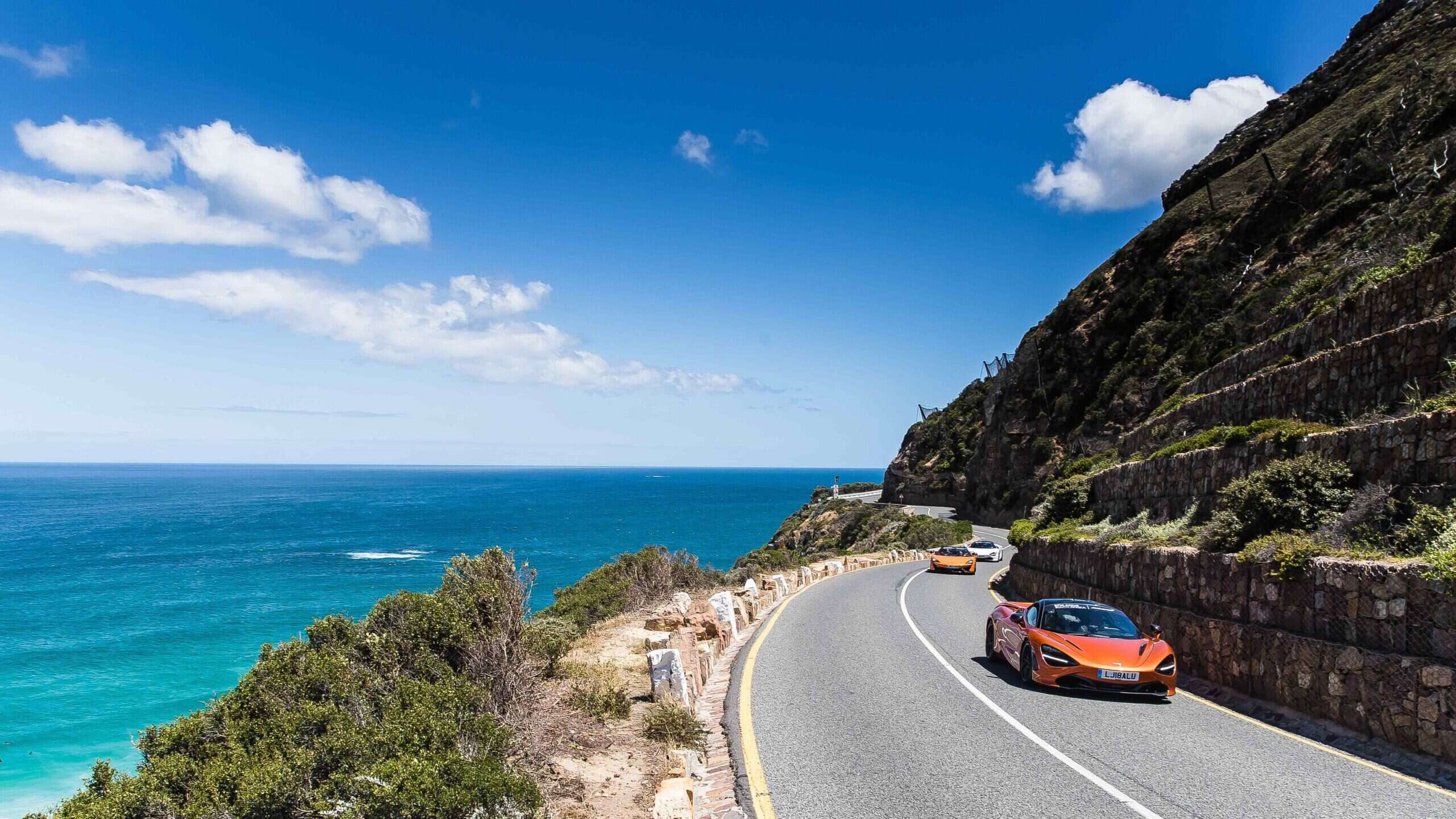 McLaren driving on the coast
