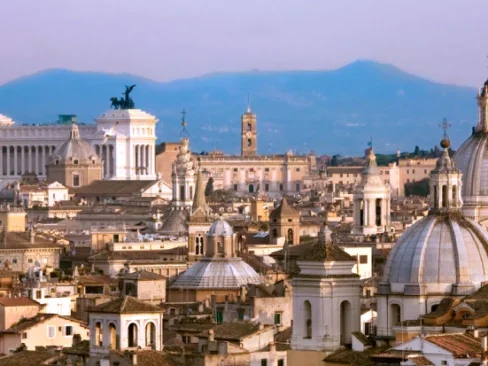 Aerial view of the center of Rome over the rooftops - View of Rome with the Vittoriano and the Apennine mountains in the background