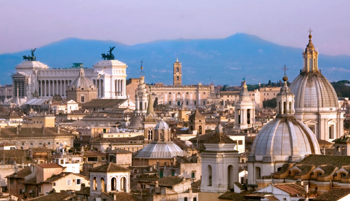 Aerial view of the center of Rome over the rooftops - View of Rome with the Vittoriano and the Apennine mountains in the background