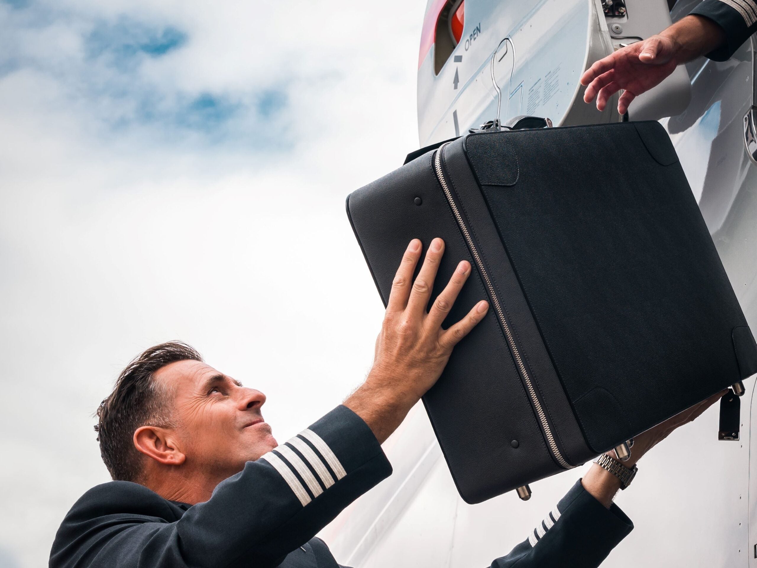 VistaJet Valextra suitcase outside a plane