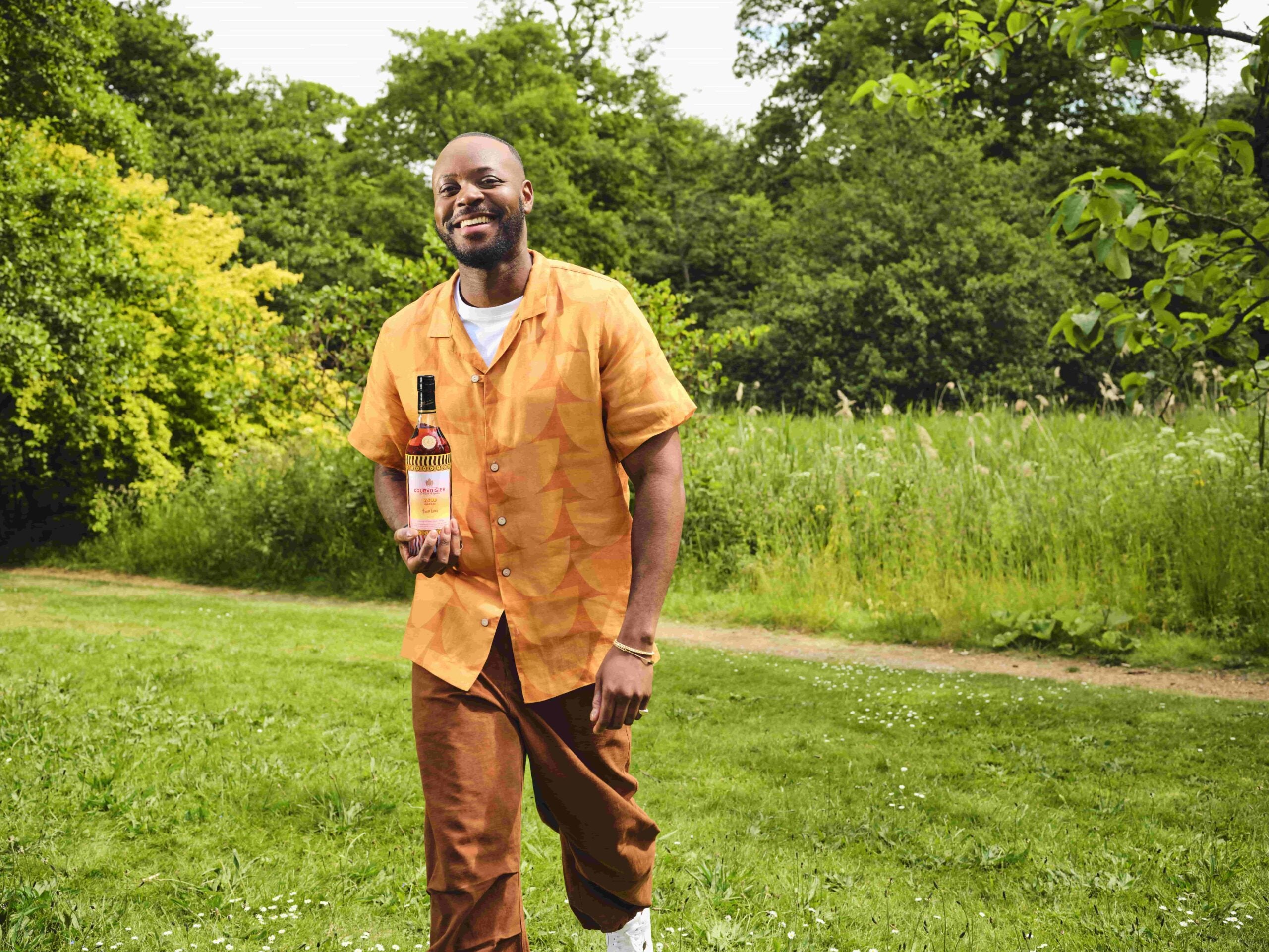 Yinka Ilori holding Courvoisier 