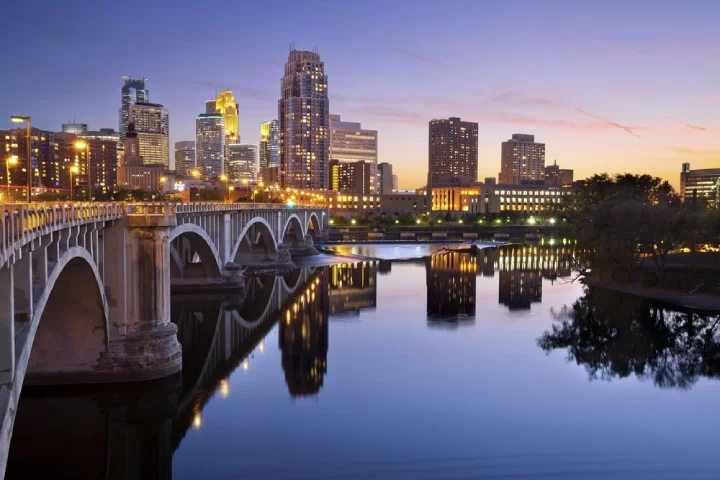 Minneapolis' skyline and its bridge at sunset