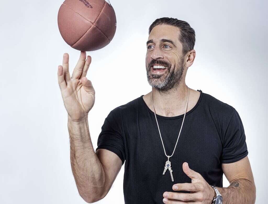 Aaron Rodgers spinning a football