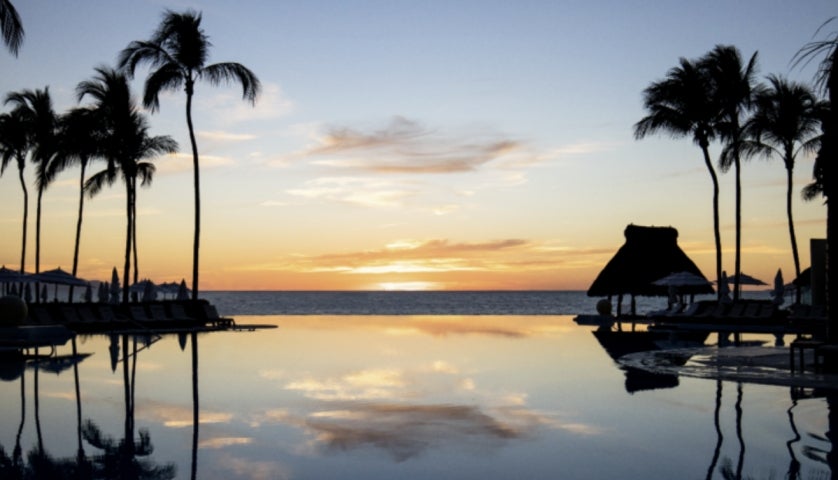 Sunset on the sea and the pool at the Grand Velas Riviera Nayarit resort.