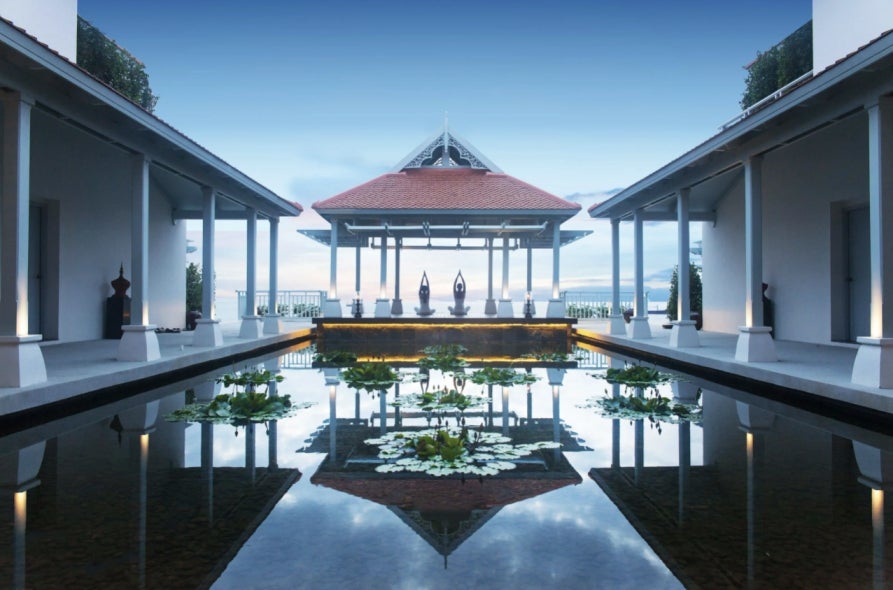 People are meditating in a temple at Amatara Wellness Resort.