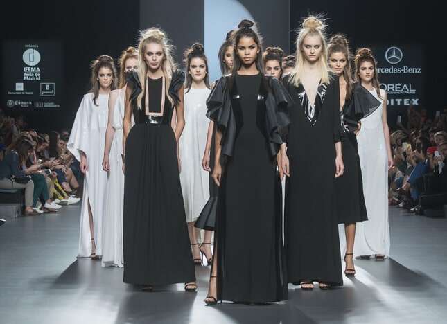 Models walk the runway at Madrid Fashion Week. 