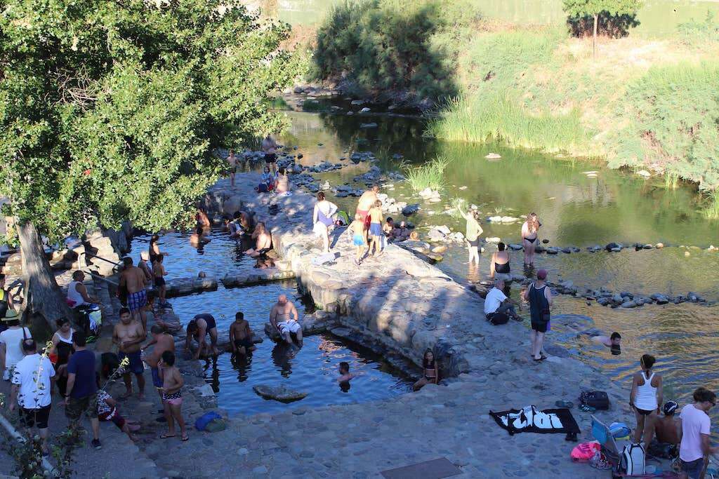 Families bathe in the thermal pools near Arnedillo in La Rioja, Spain. 