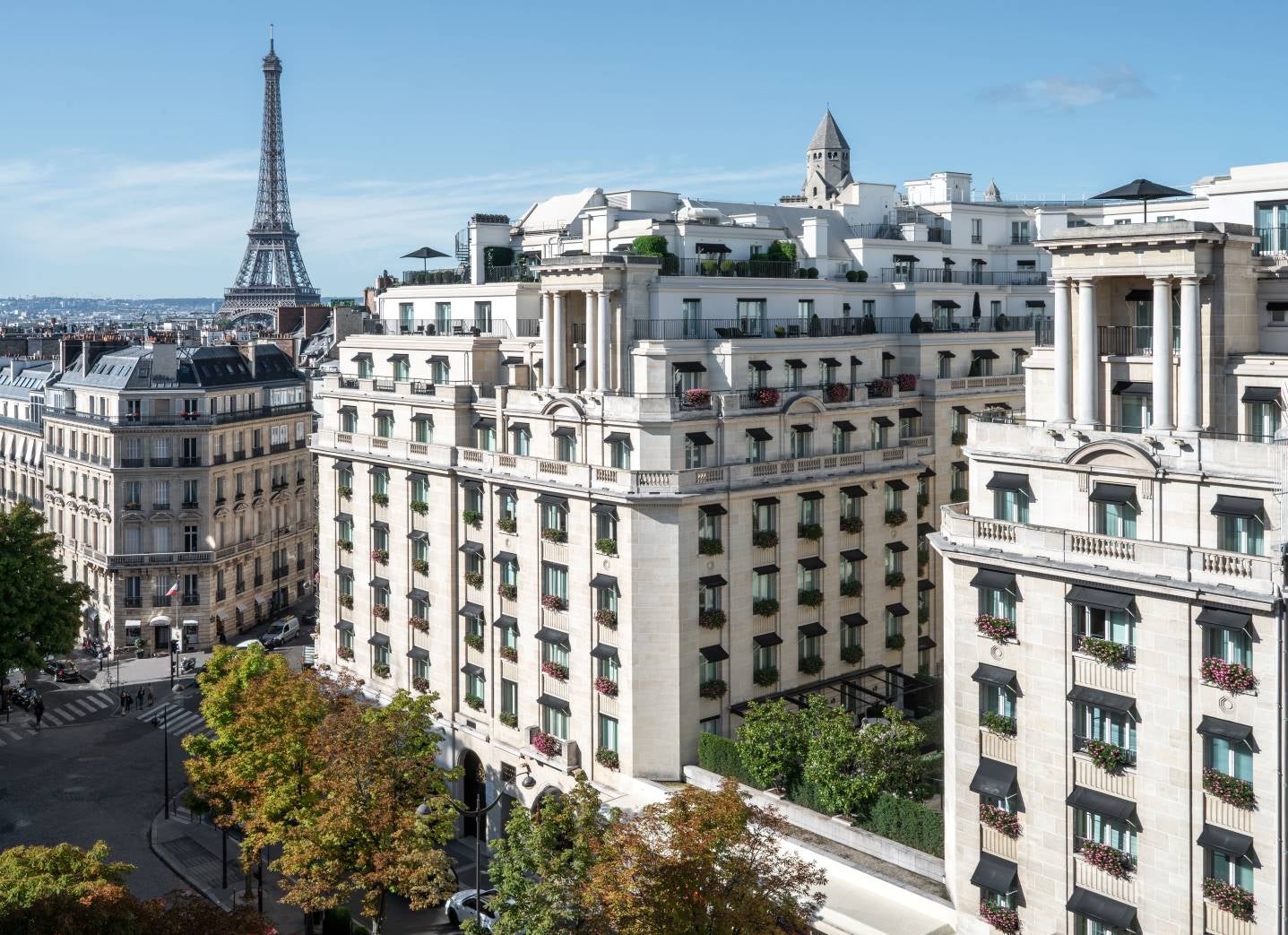 Best hotel in Paris. Image showing the luxurious Four Seasons Hotel George V facade with the Eiffel Tower in the background in Paris