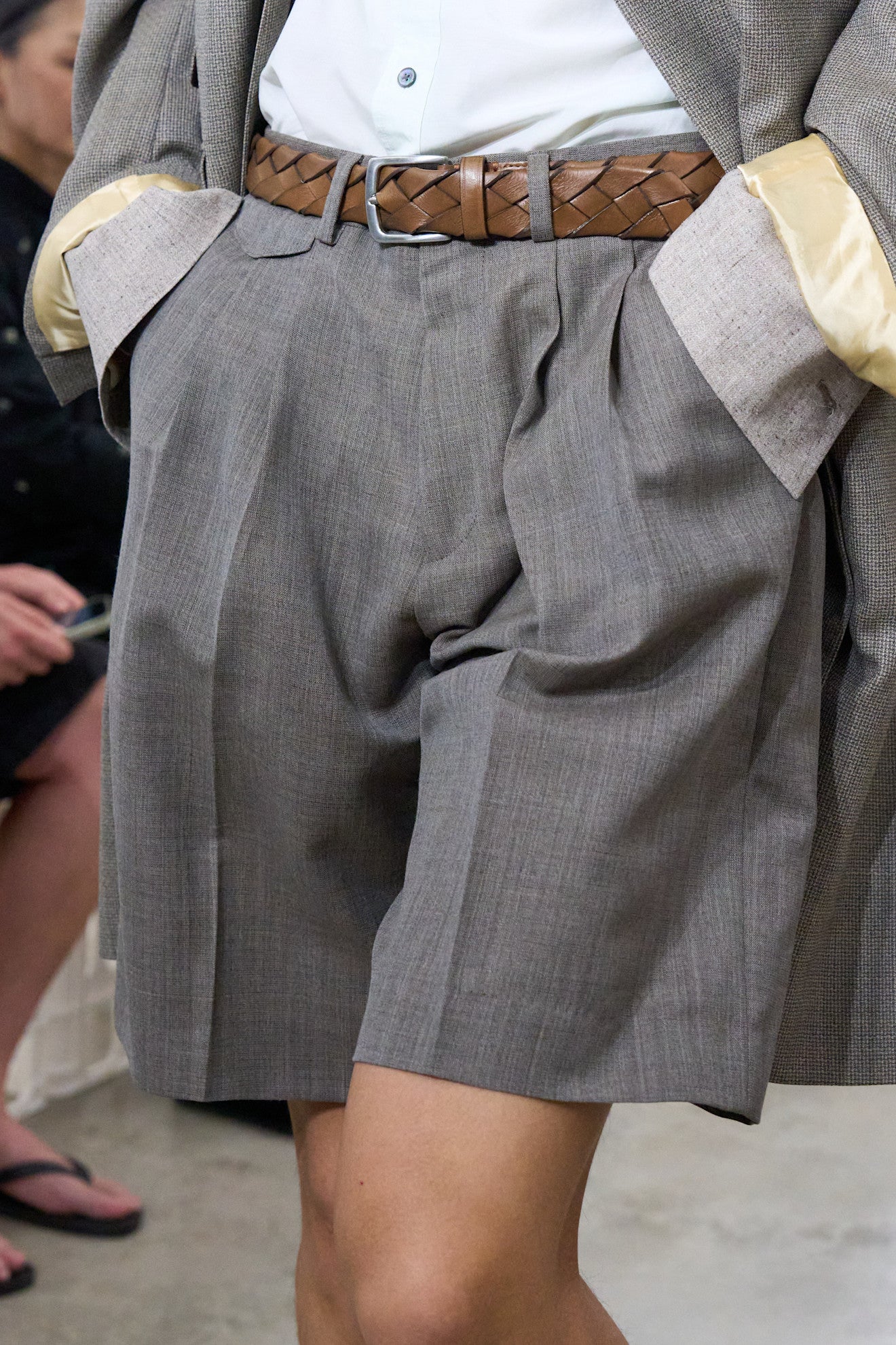 Close up of model in shorts at Paul Smith SS27 runway show ; can men wear shorts to office debate