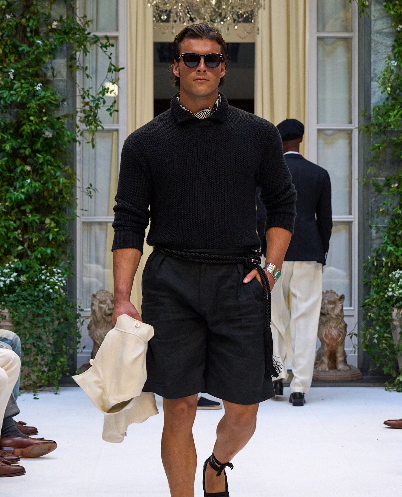 Model in shorts at Ralph Lauren SS27 runway show ; can men wear shorts to office debate